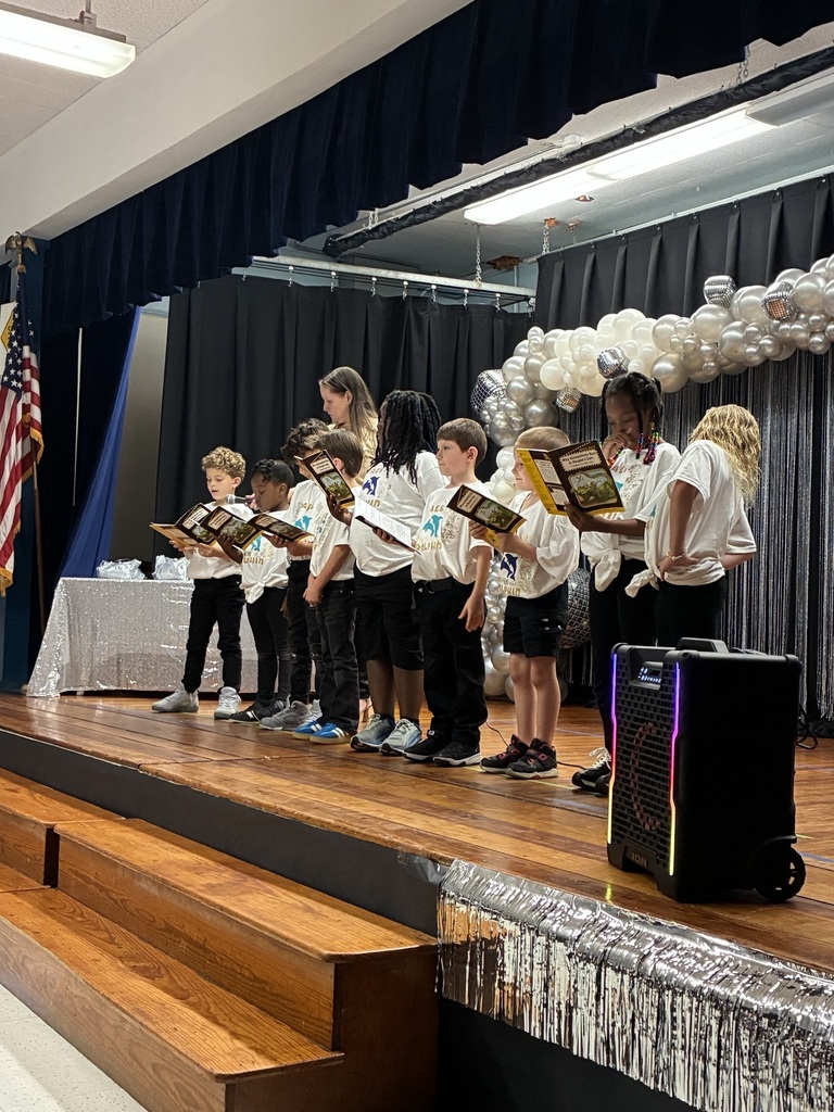 Students and teacher on stage