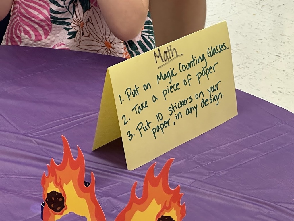 Activity Card that says Math: Put on magic counting classes. take out a piece of paper. put 10 stickers on your paper, in any design,