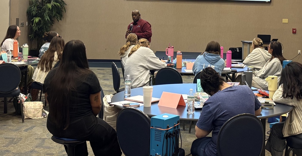 Mr. Brown speaks to a group of teachers in the Jacksonville Teacher Residency program at a professional development conference.