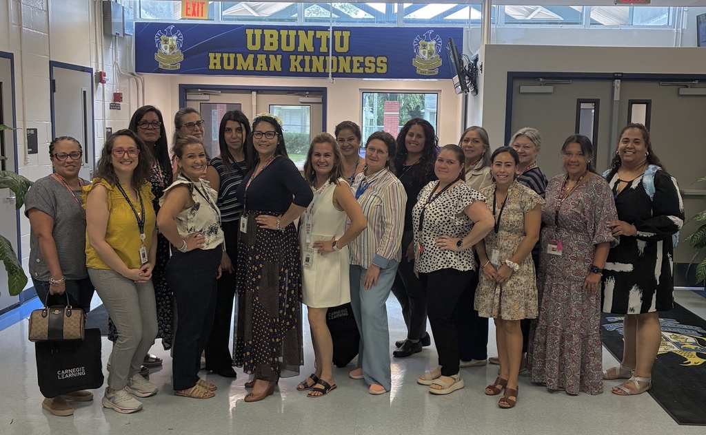 A group of ESOL, Dual Language, and World Languages teachers pose for a group photo during professional development.