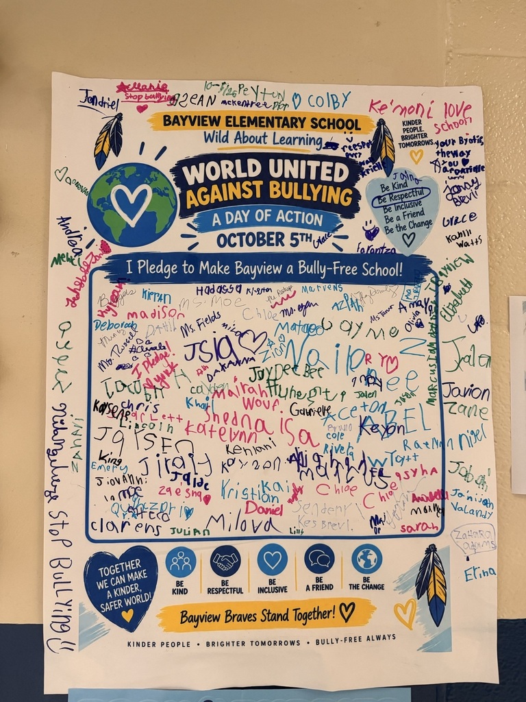 A colorful poster with a white background. It says "World United Against Bullying" and has signatures and drawings.