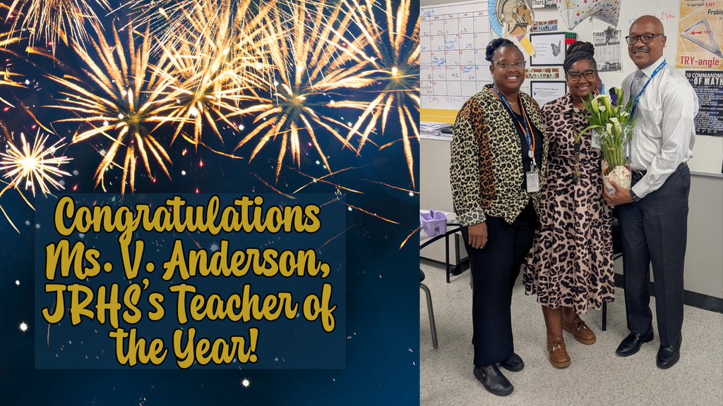 Three people stand in a room, with fireworks in the background. A sign reads "Congratulations Ms. V. Anderson, JRHS's Teacher of the Year!"