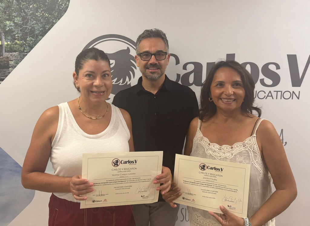 Ms. Crespo-Lowery and Ms. Zamira Pauley smile while taking a photo with their certificates from the ALAS Carlos V Education Program.