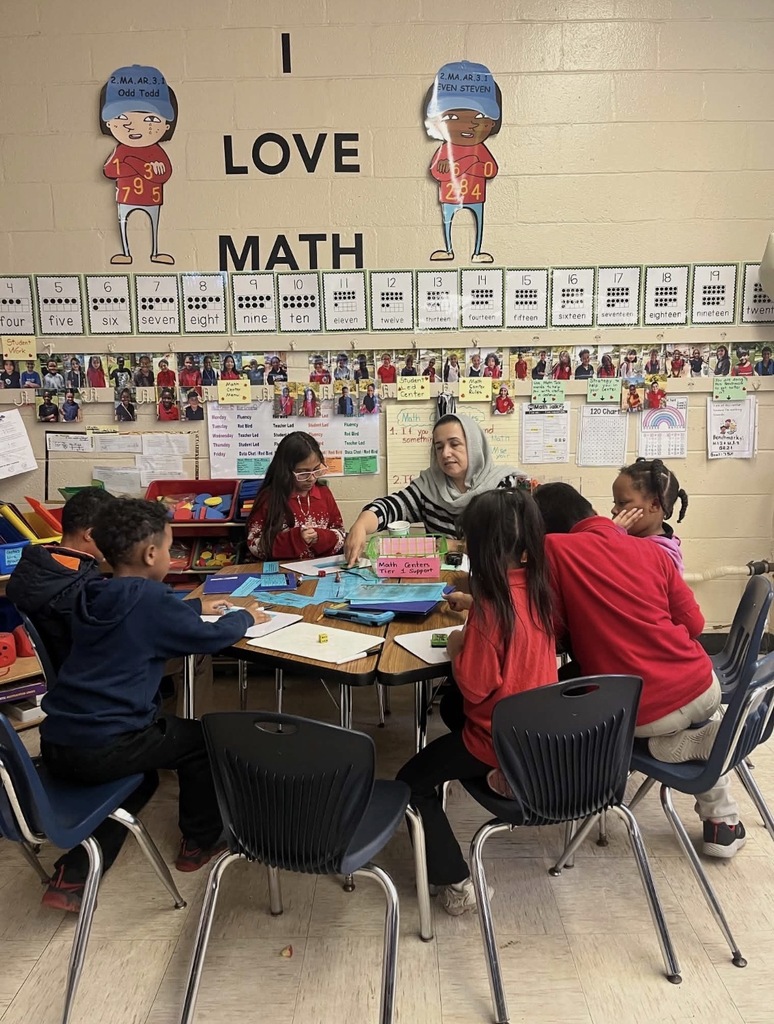 Zarmina Malalai teaches a small group of students. 