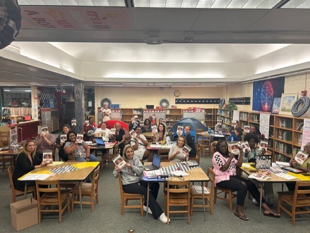 Faculty at Fort Caroline Elementary holding copies of Vincent Taylor's book If Instruction isn't Engaging, I Quit to showcase their book study as a group.