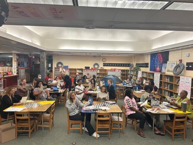 Faculty at Fort Caroline Elementary holding copies of Vincent Taylor's book If Instruction isn't Engaging, I Quit to showcase their book study as a group.