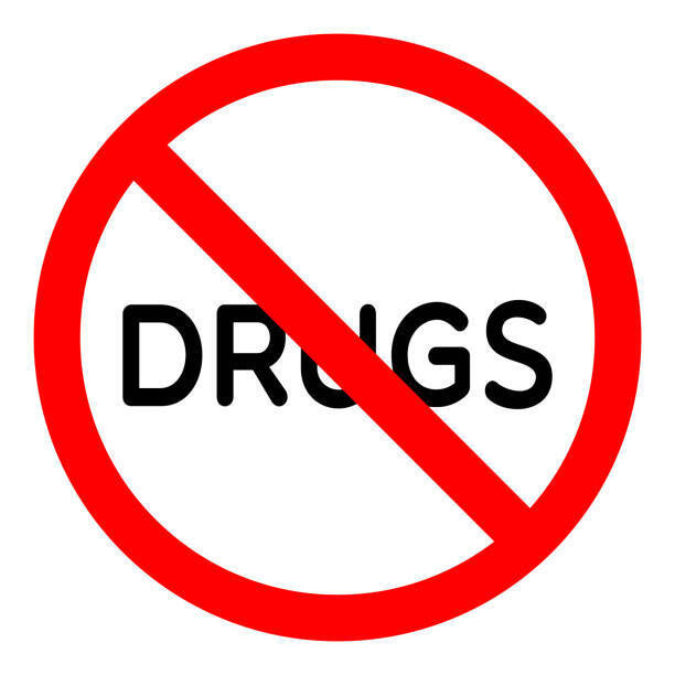 Red circle with white background contains word "DRUGS" crossed by a diagonal red line.