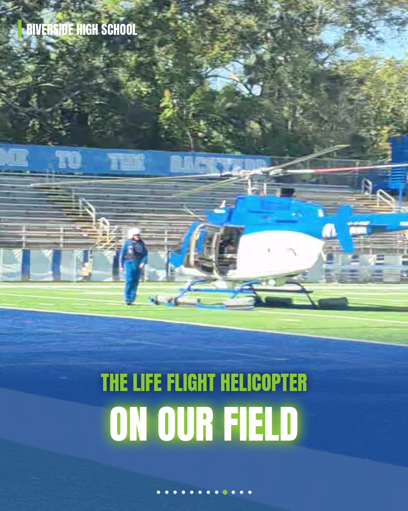 Blue and white helicopter on field. Person in blue jumpsuit stands near. Text: "The Life Flight Helicopter on our field."
