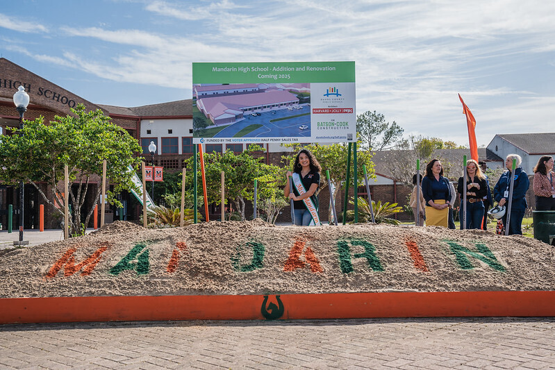 mandarin high school student with shovel at groundbreaking