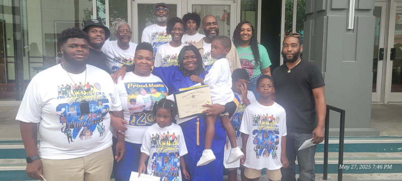 Juley'a Sanders and her family at graduation