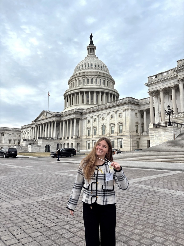 Lidia Ray standing in front of the U.S. Capitol building