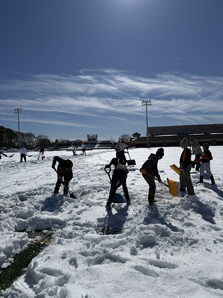 Students shoveling the track