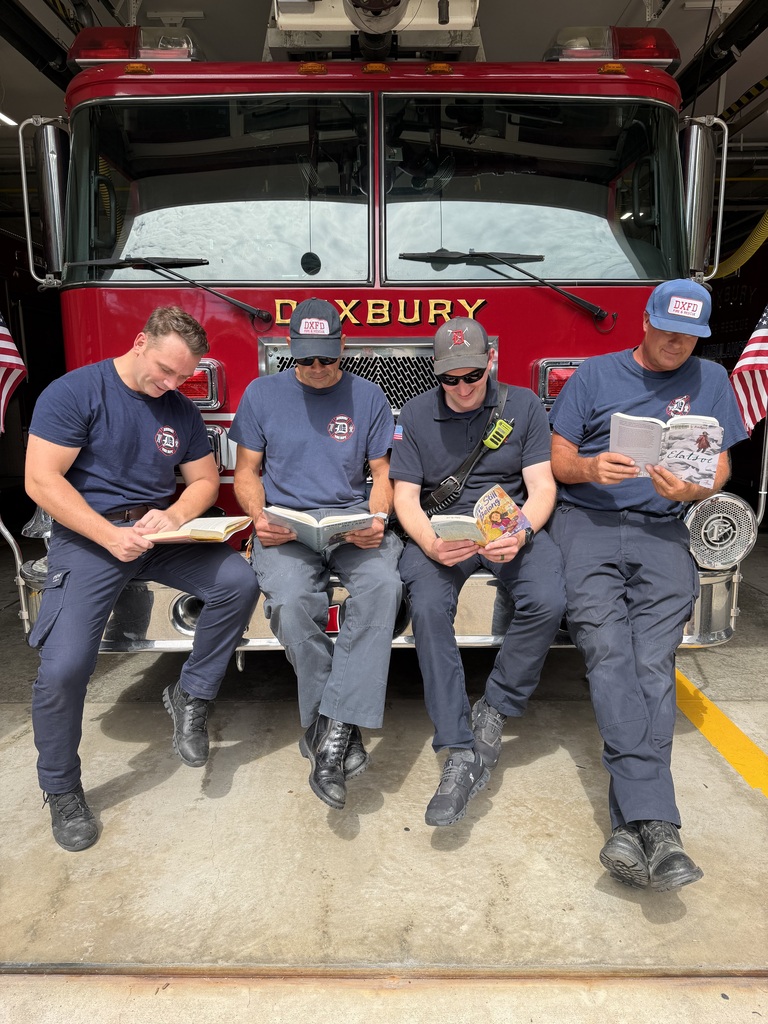 Duxbury Fire Department members reading summer reading books