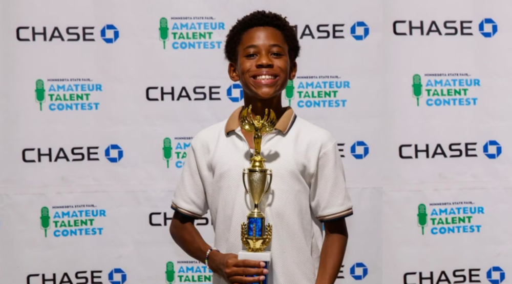 charles foster holding trophy