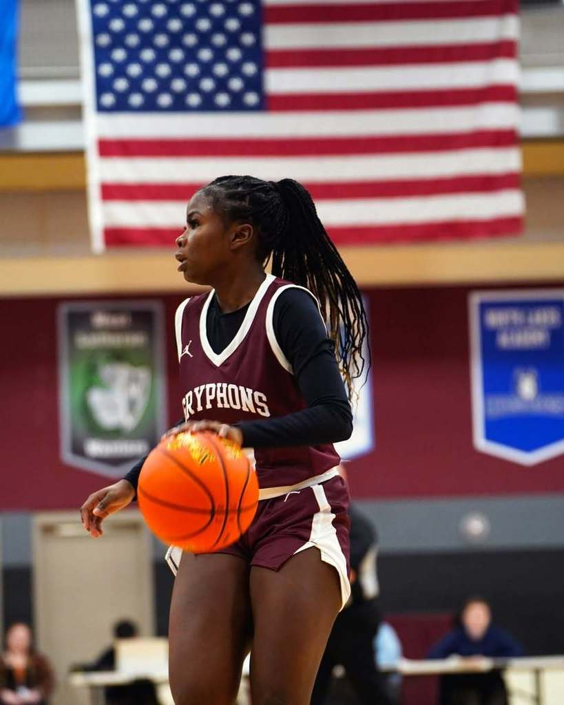 female basketball player dribbling