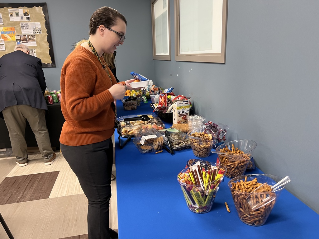 woman looking at a table of food