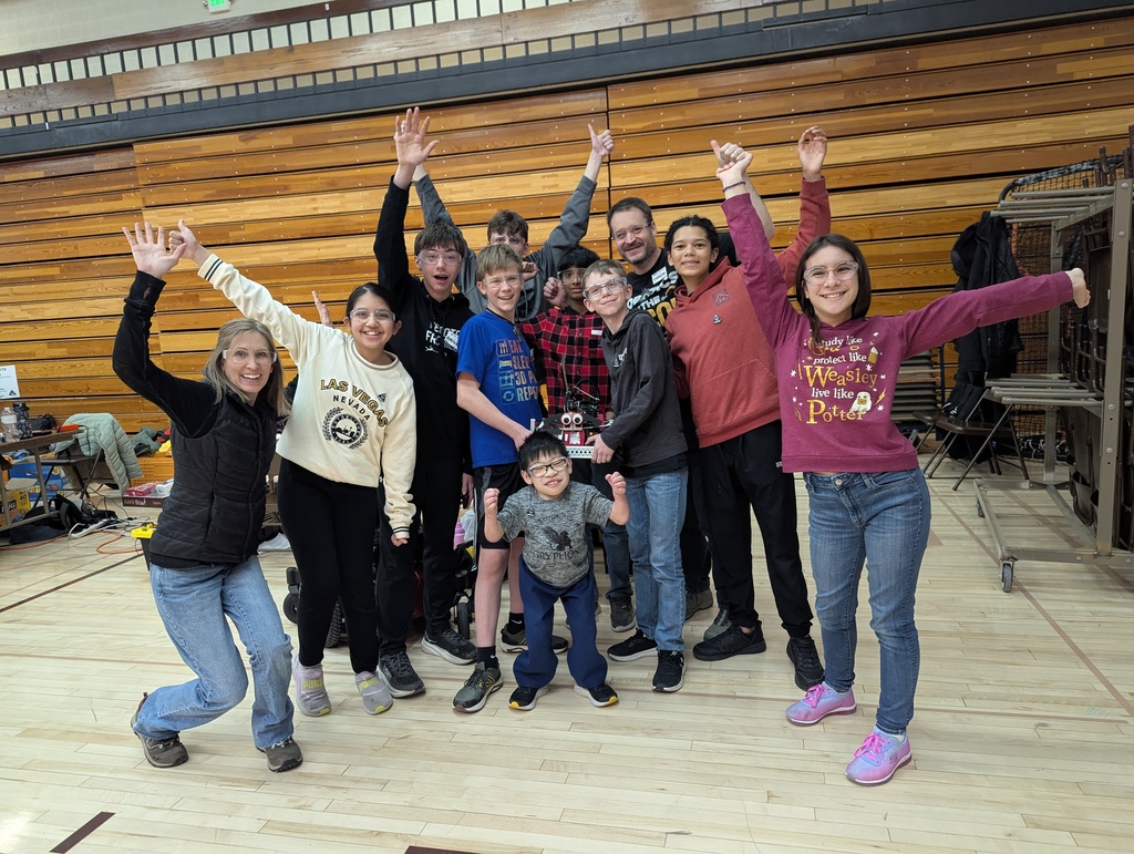 students celebrating with hands up