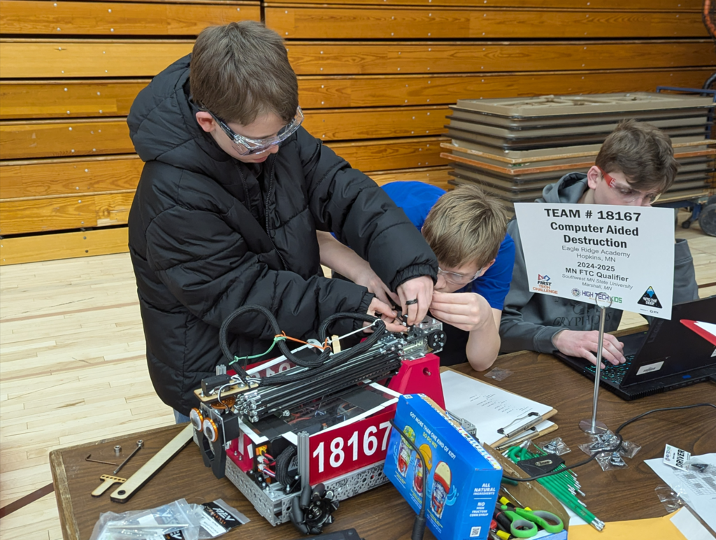 students working on a robot