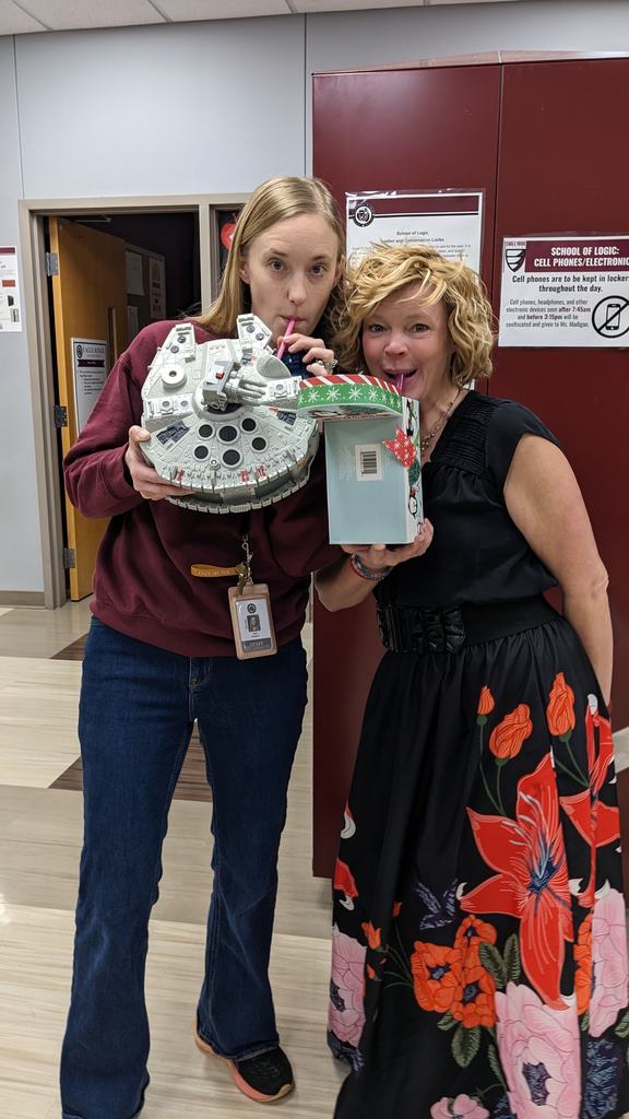 two women drinking from a lego set and a box