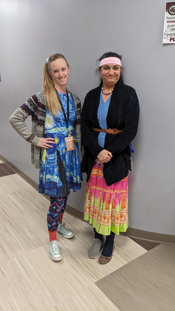 two women in colorful outfits