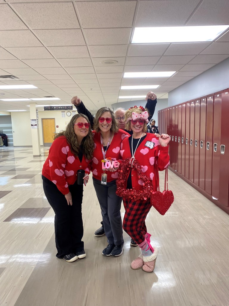 group of women in heart-themed outfits