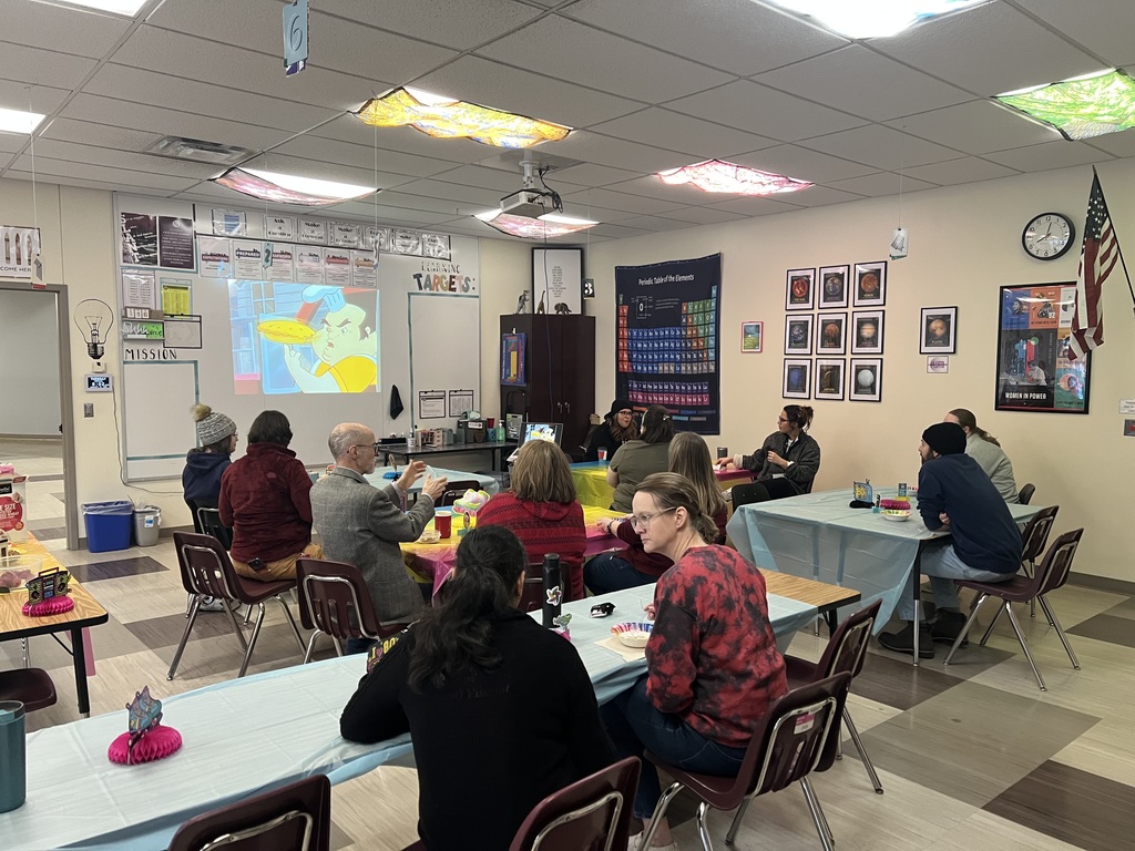 adults watching cartoons