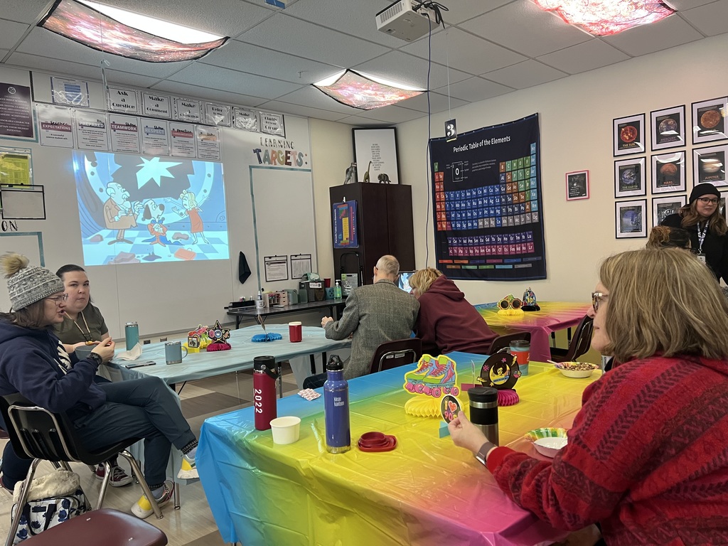 adults watching a cartoon