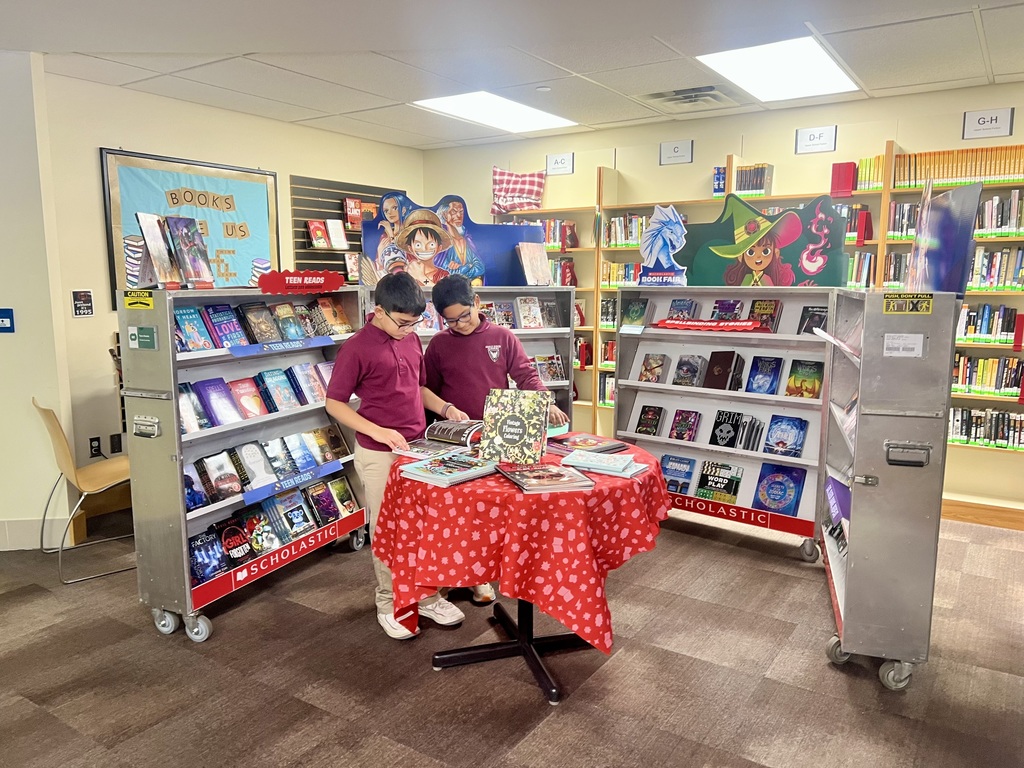 boys looking at a book