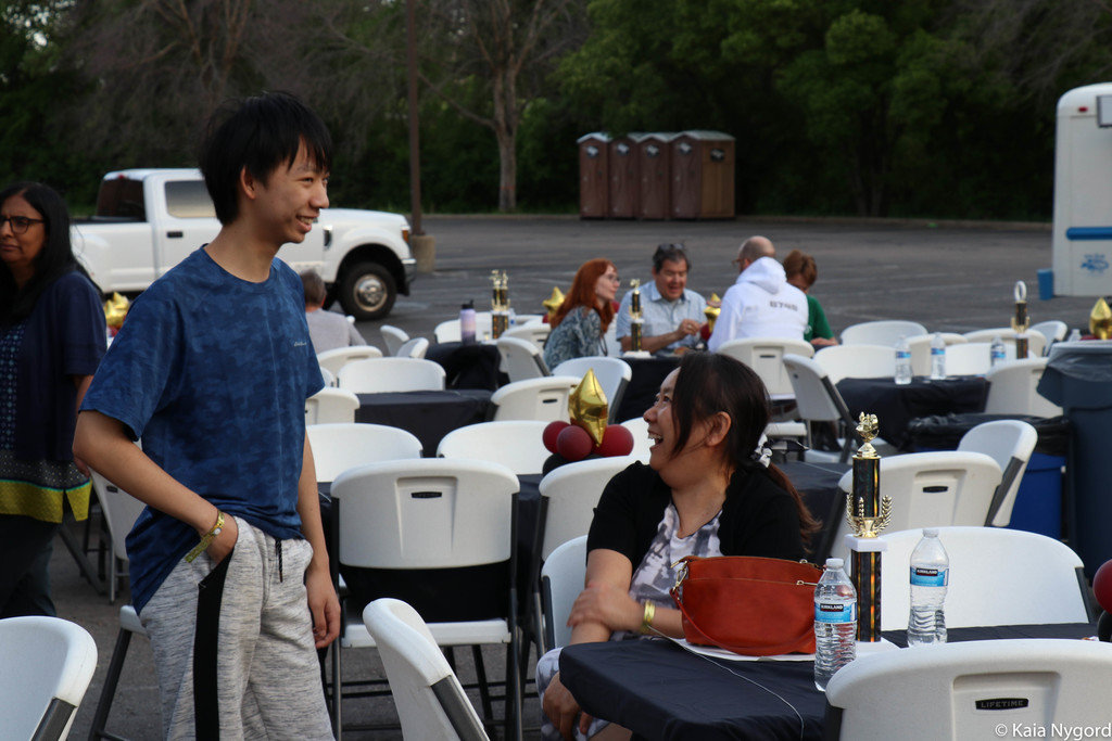 people laughing at tables