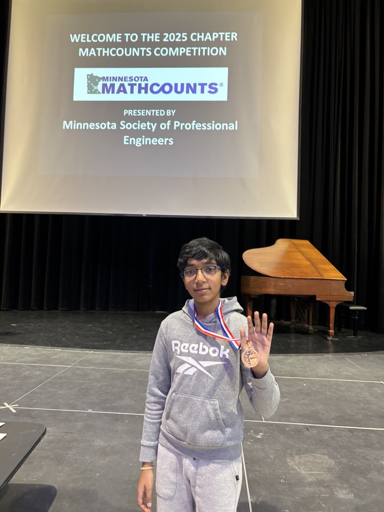 Sai holding math medal