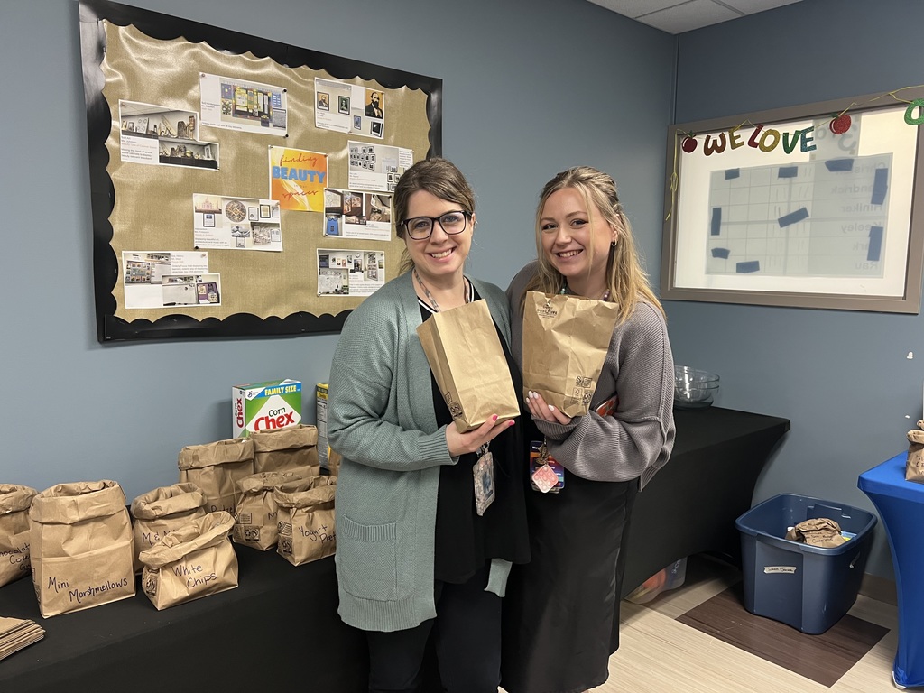 teachers posing with bags