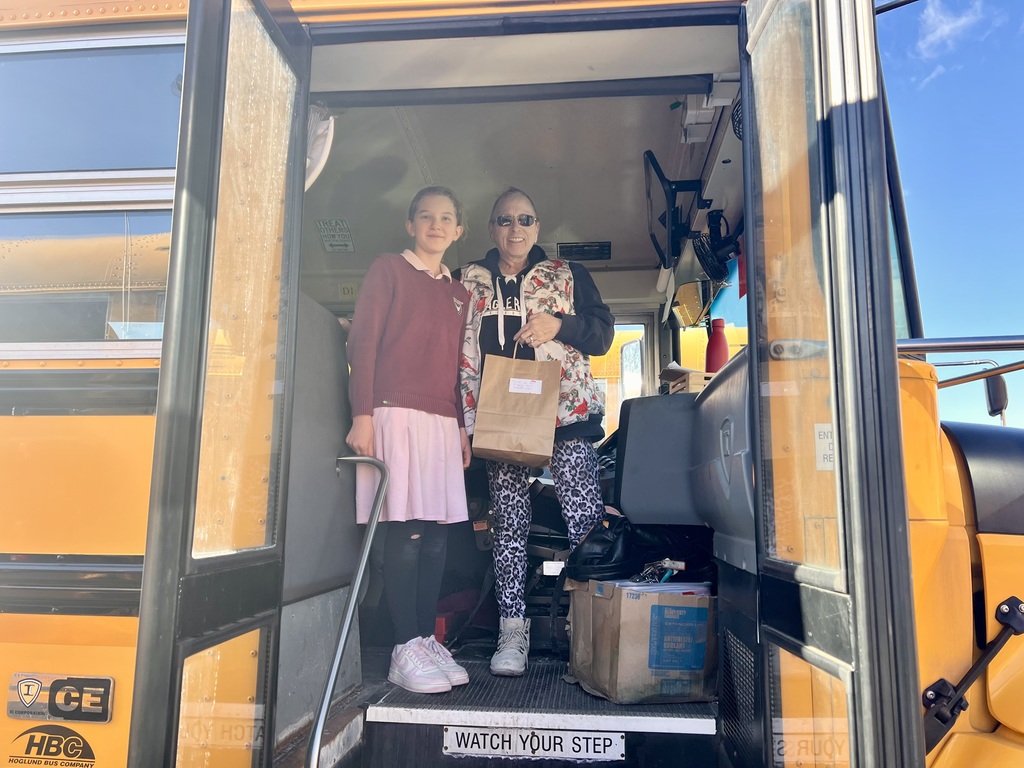 student with a bus driver