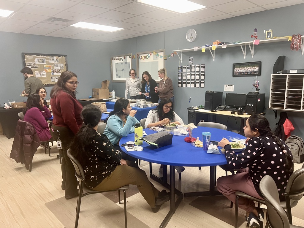 staff sharing food in the lounge