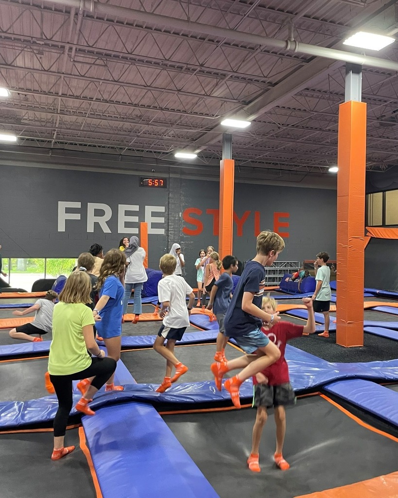 Students jumping on trampolines