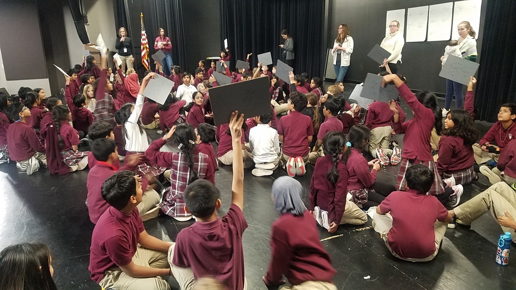 Students holding signs