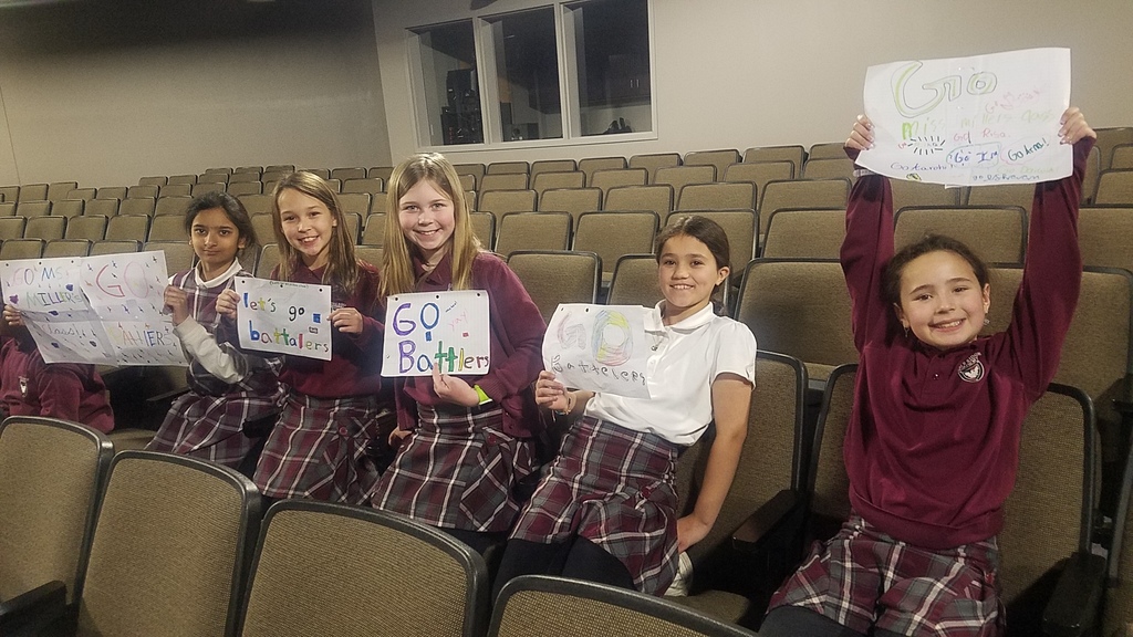 Students holding signs
