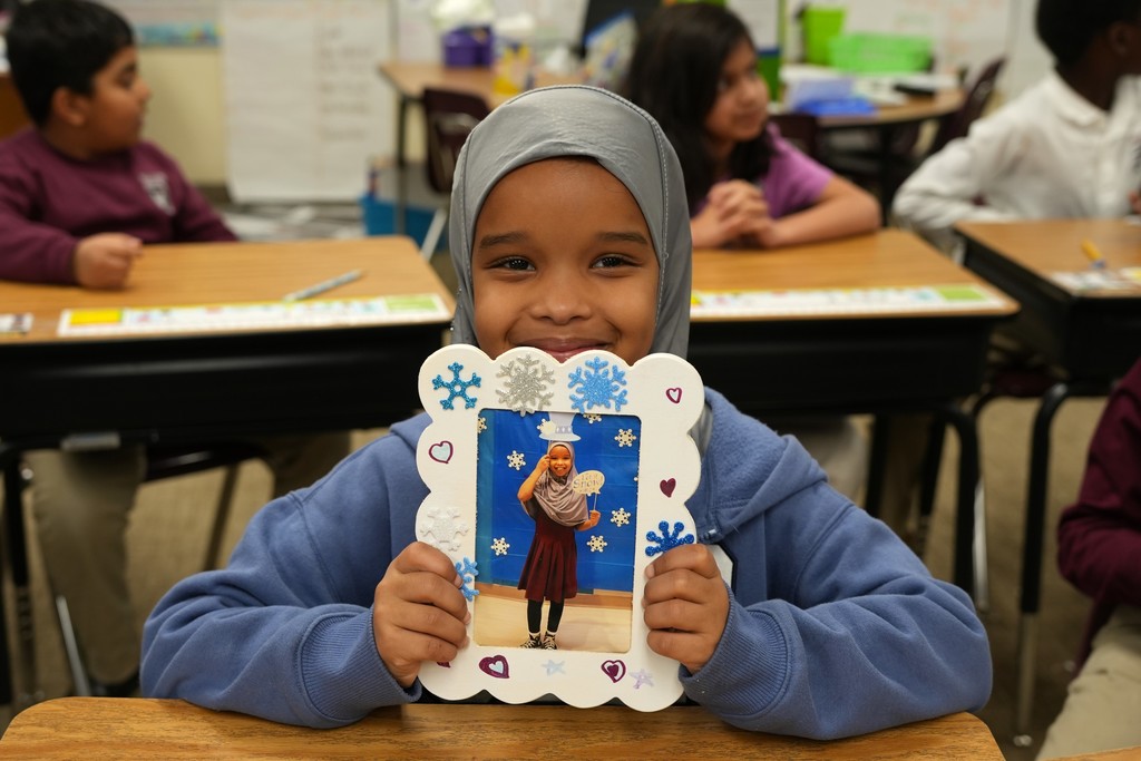 student with winter craft