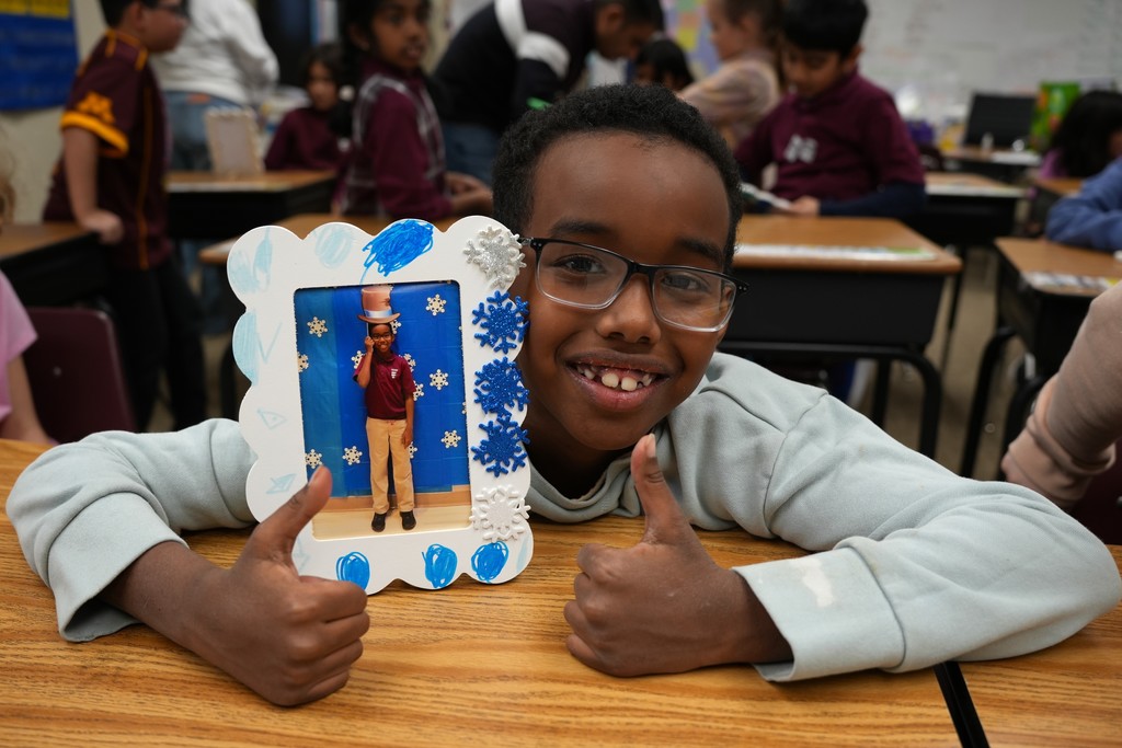 student with winter craft