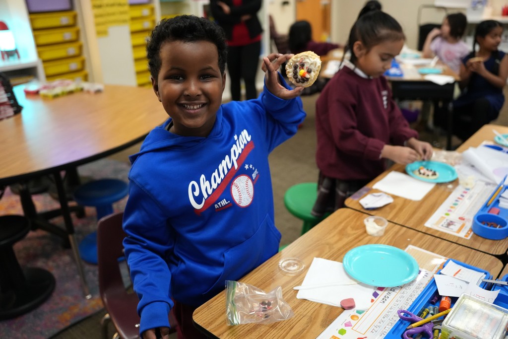 student with winter cookie