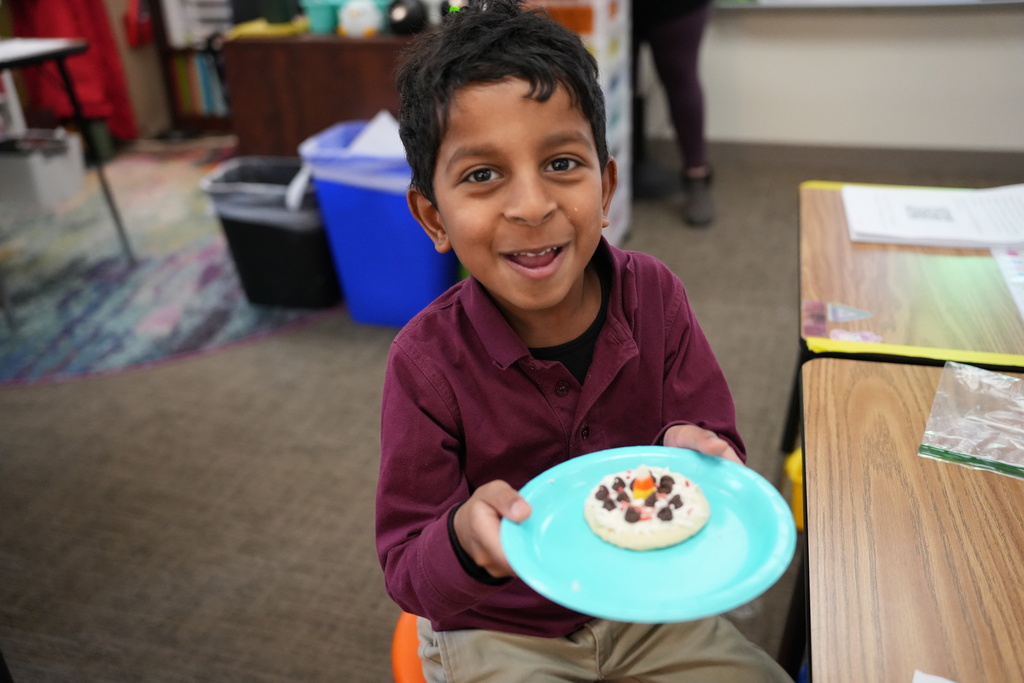 student with winter cookie