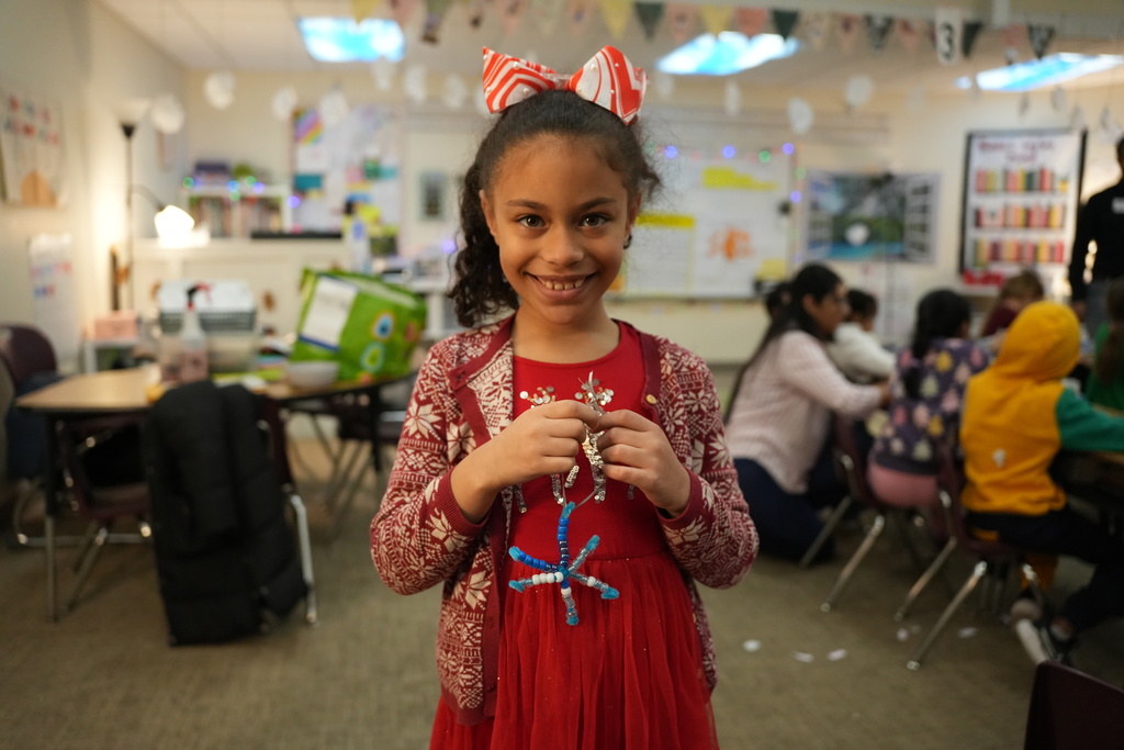 student with winter craft