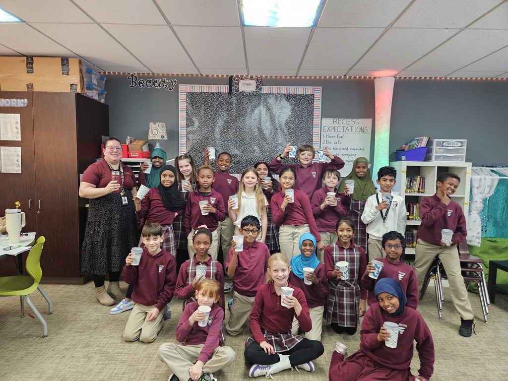 students with cups of hot chocolate