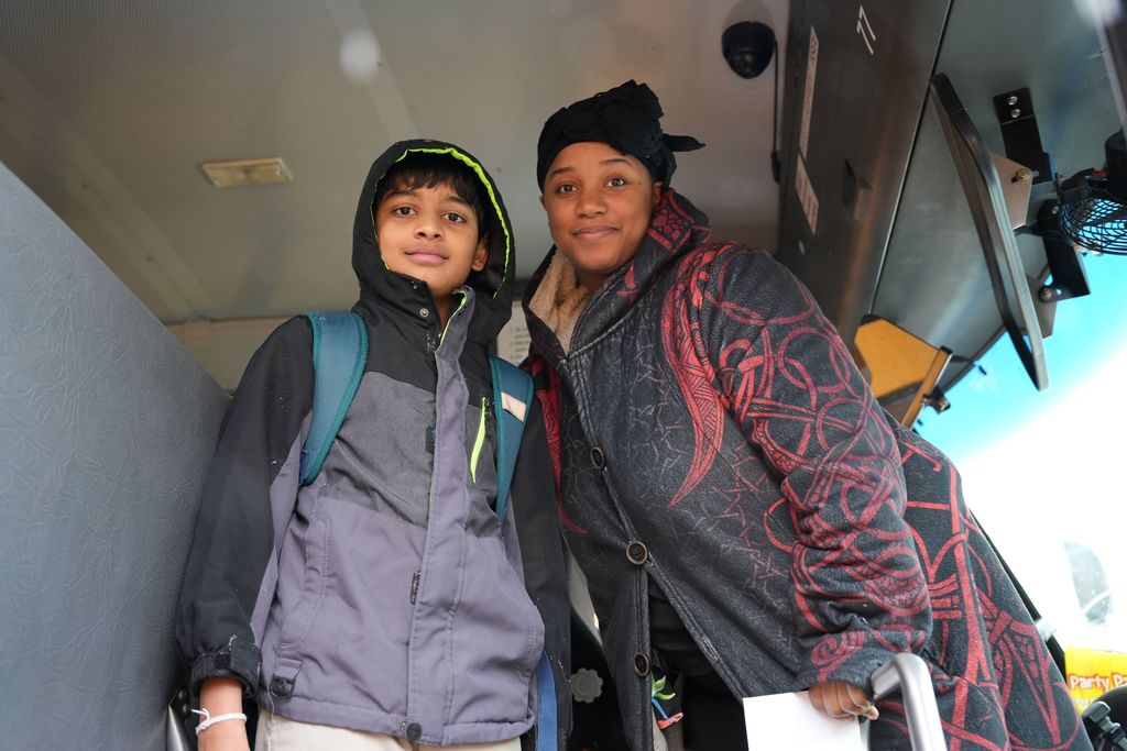 student with bus driver