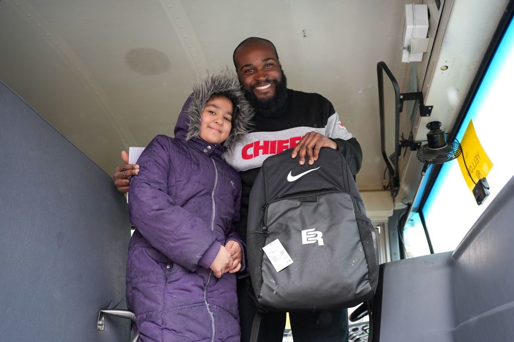 student with bus driver