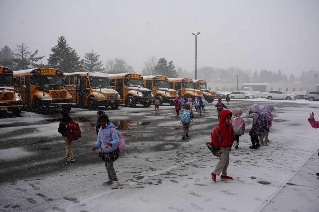 student with bus driver