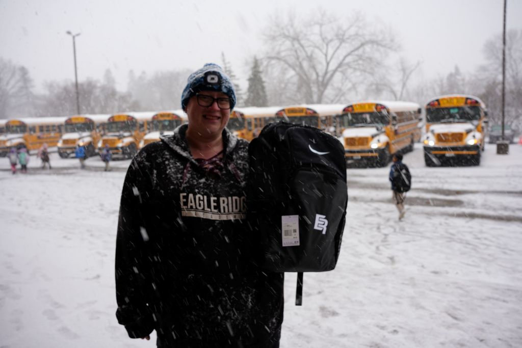 student with bus driver
