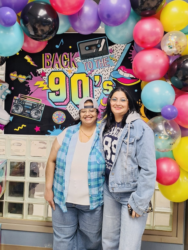 staff dressed in 90s wear