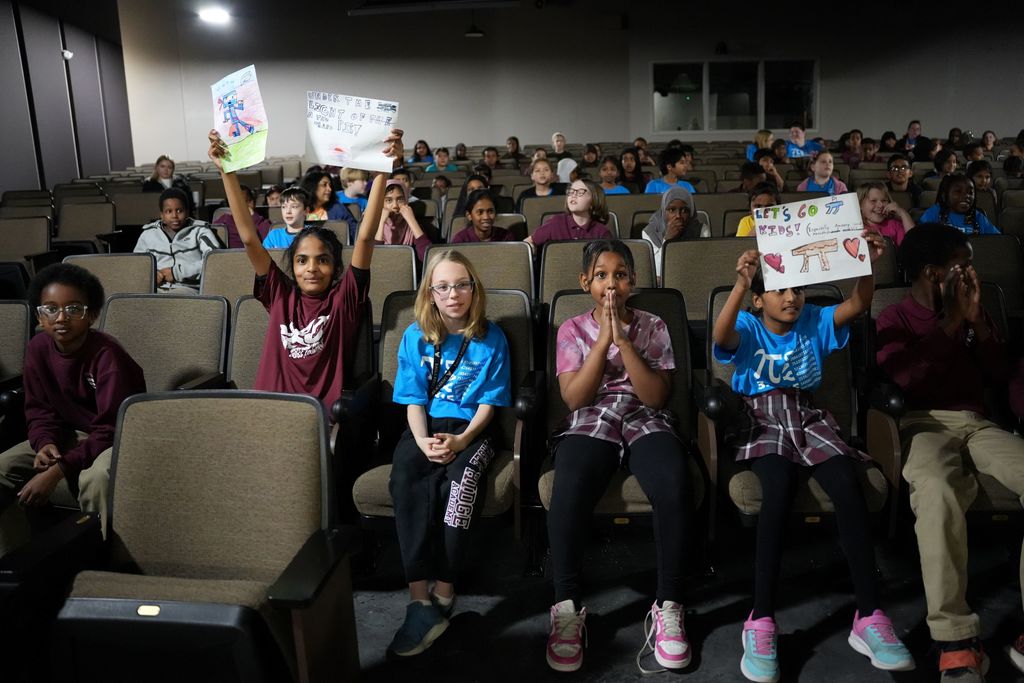 students holding signs