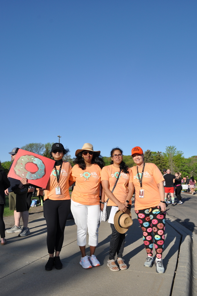 ladies with donut sign and pants