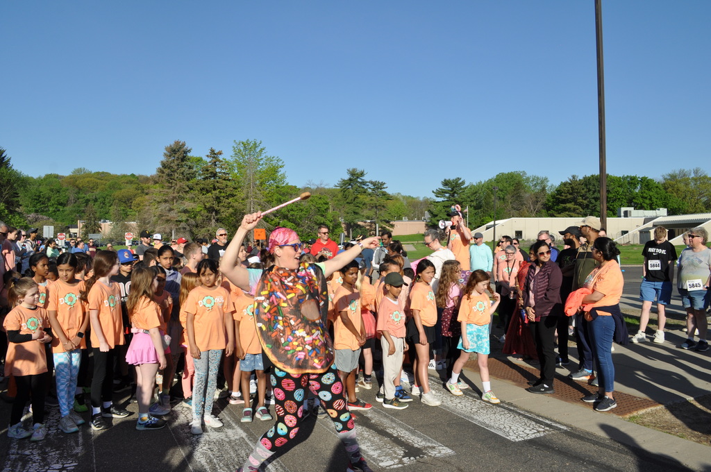 donut costume pointing